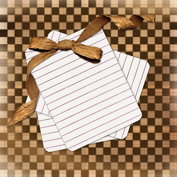 Grunge card with sheet and brown bow — Stock Photo, Image