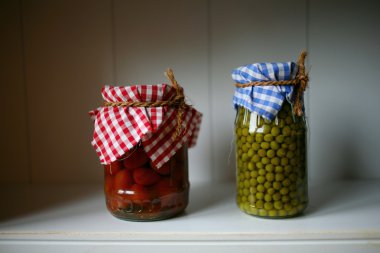 Green peas and tomatoes in the pantry clipart