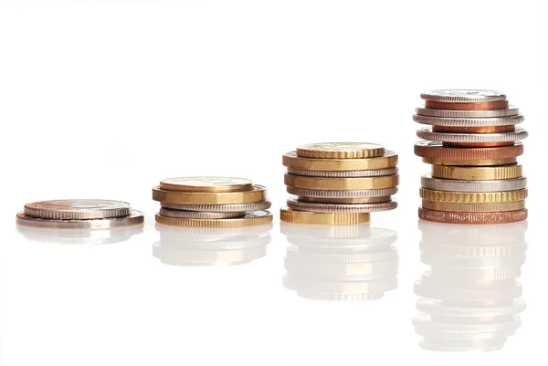 Column of coins on a white background — Stock Photo, Image