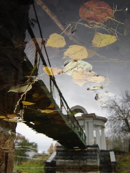 Stock image Relection of a small bridge