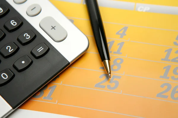 The handle and the calculator — Stock Photo, Image