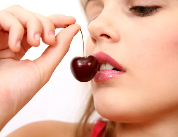 The girl with a cherry — Stock Photo, Image