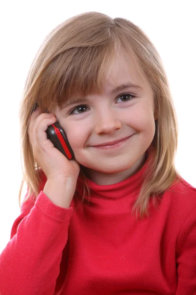 Den vackra unga flickan talar via telefon — Stockfoto