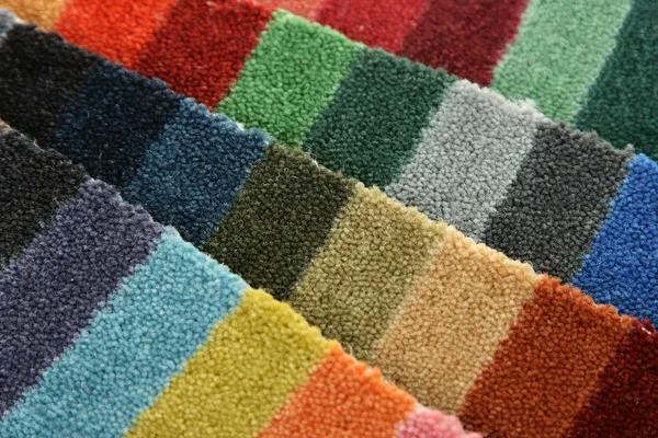 Prover av färg på en matta som täcker — Stockfoto