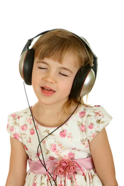 Menina ouvir música em fones de ouvido . Imagens Royalty-Free