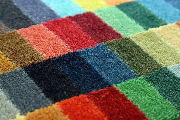 Prover av färg på en matta som täcker — Stockfoto