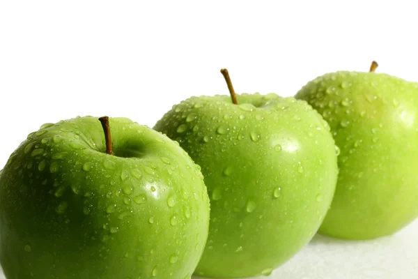 Tři zelené jablko — Stock fotografie