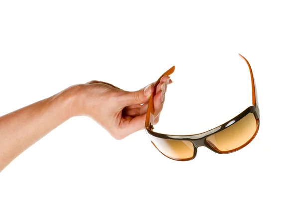 Zonnebrillen in hand geïsoleerd — Stockfoto