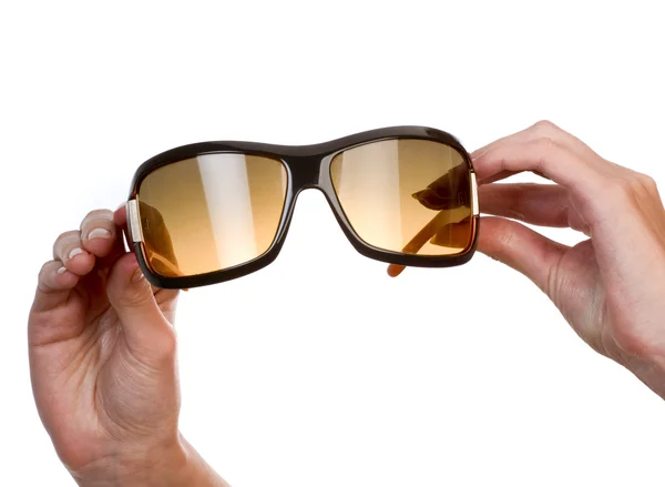 Sunglasses in hand isolated — Stock Photo, Image