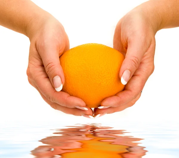 Orange in hand — Stock Photo, Image