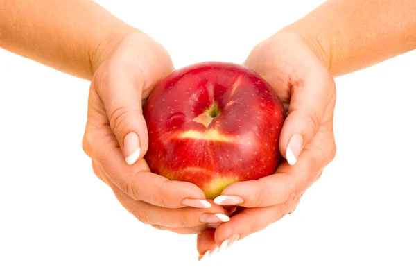 Červené jablko v ruce — Stock fotografie