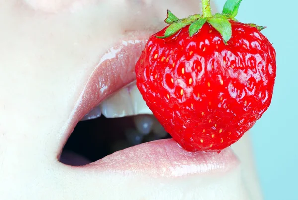 Girl eating strawberries Stock Photo