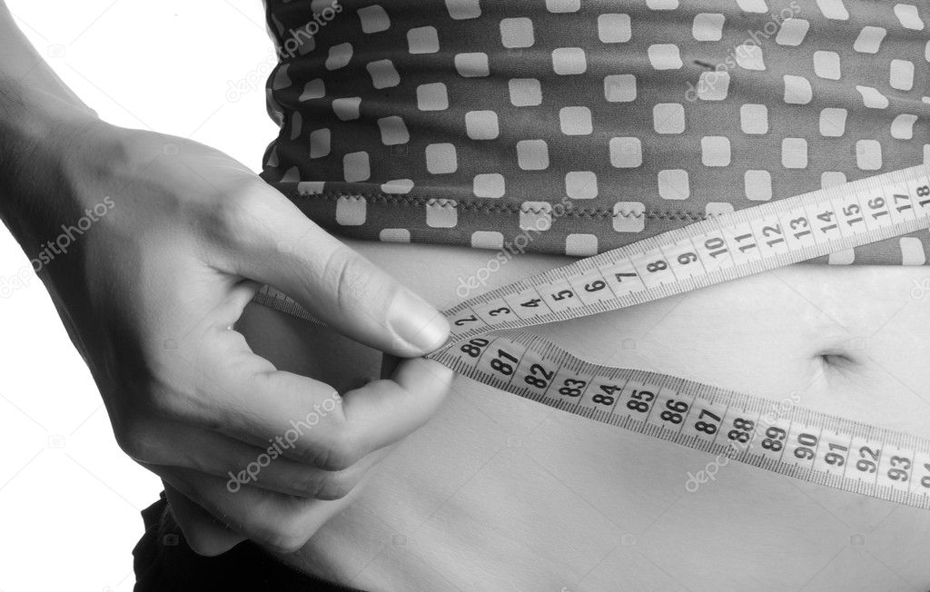 Girl measuring waist
