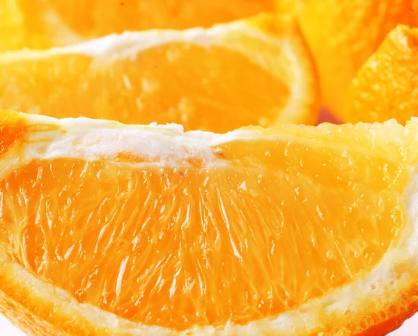 stock image Macro. segments of an orange. white back