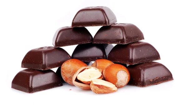 Bar of chocolate and hazelnuts on a whit — Stock Photo, Image
