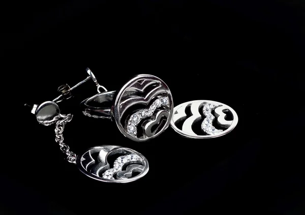 stock image Jewelry of silver on a dark background