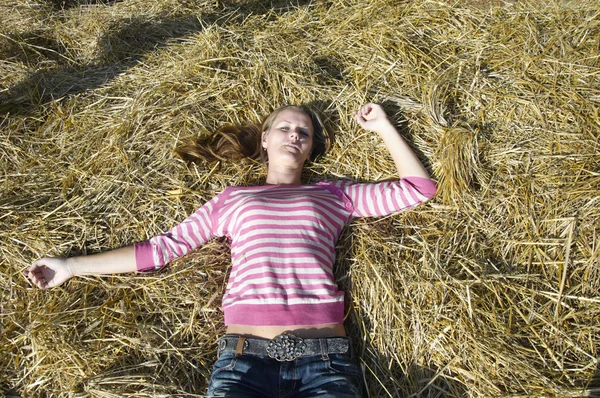 Girl in the straw — Stock Photo, Image
