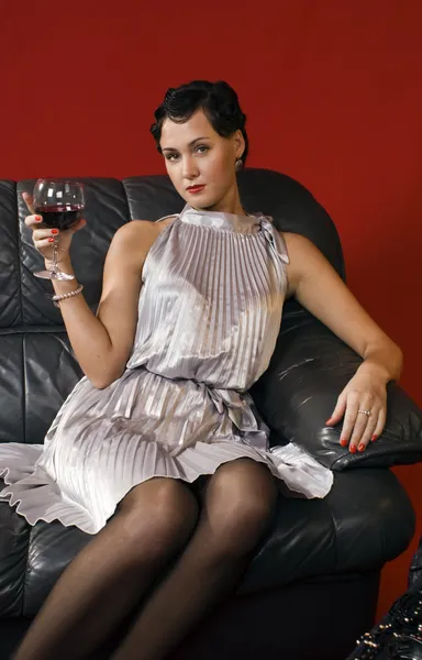 Beautiful young woman with a glass of wi — Stock Photo, Image