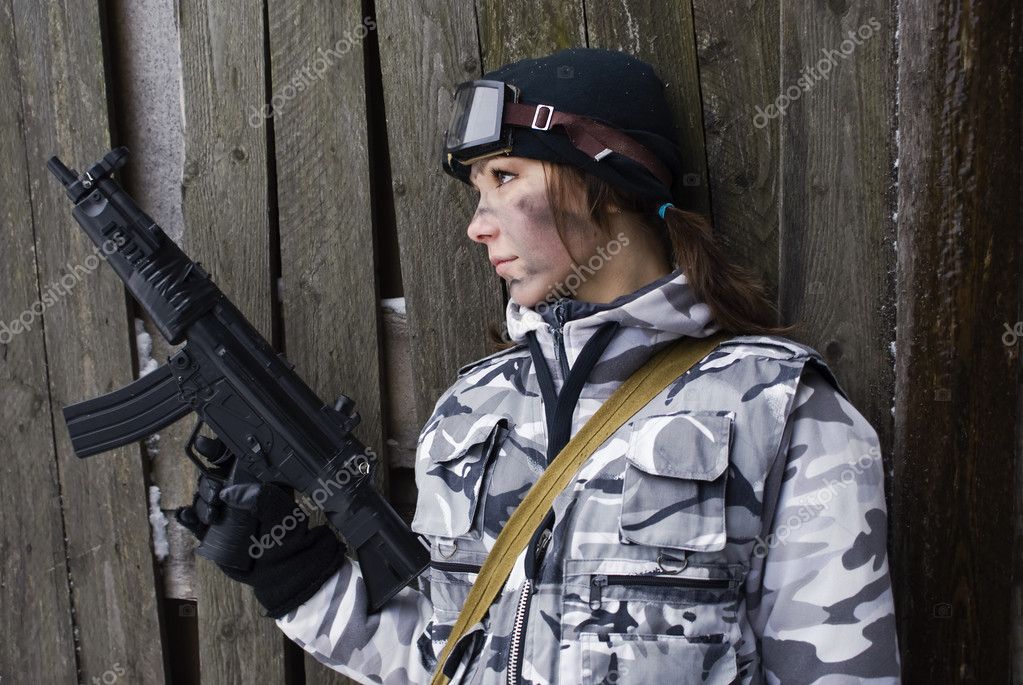 Girl in a camouflage with the gun — Stock Photo © Demian 1356549