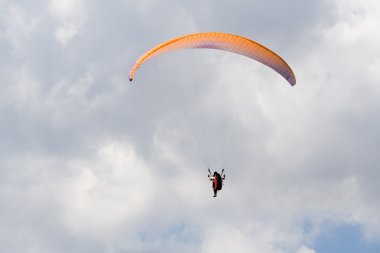 Paraglider in the clouds clipart