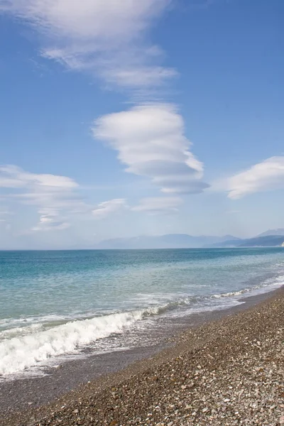 stock image Clouds at the Black sea beach