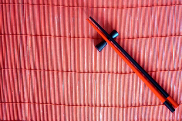 stock image Japanese sticks on red mat