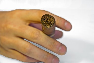 Hand with cuban cigar clipart