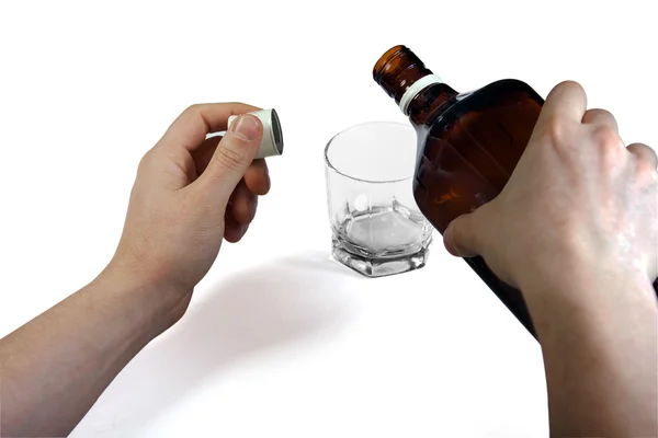 Hands with whiskey bottle — Stock Photo, Image