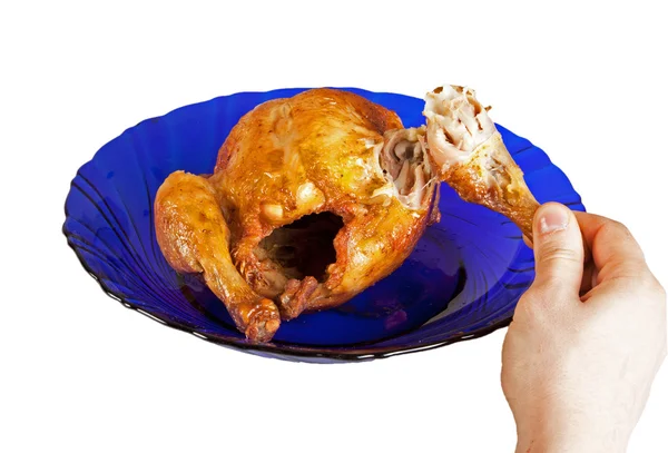 Grilled hen on dish with male hand — Stock Photo, Image