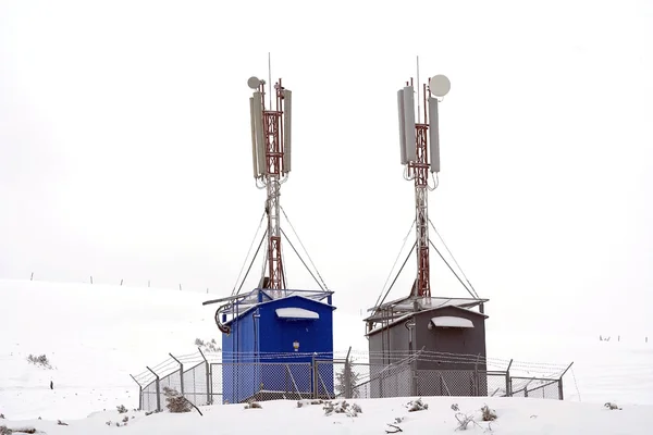 Two GSM towers in winter — Stock Photo, Image