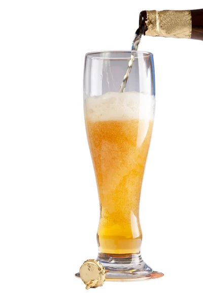 Beer flowing in the glass — Stock Photo, Image
