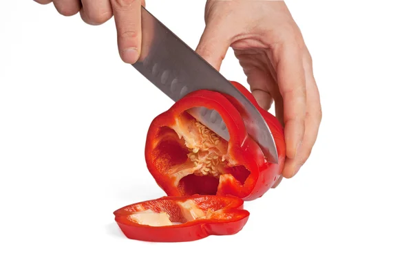 Mão humana corte pimenta com faca — Fotografia de Stock