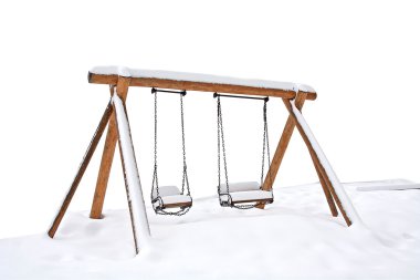 Swings covered with snow clipart