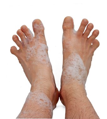 Male foots in bath foam clipart