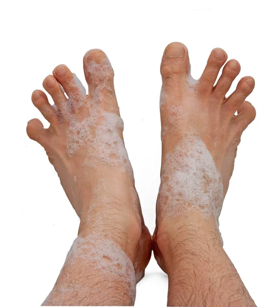 stock image Male foots in bath foam