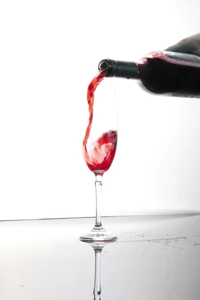 Wine streaming in the glass — Stock Photo, Image