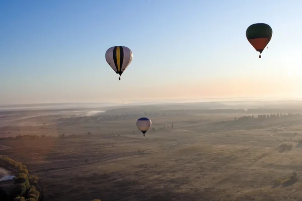 Flying balloons at sunrise — Stock Photo, Image