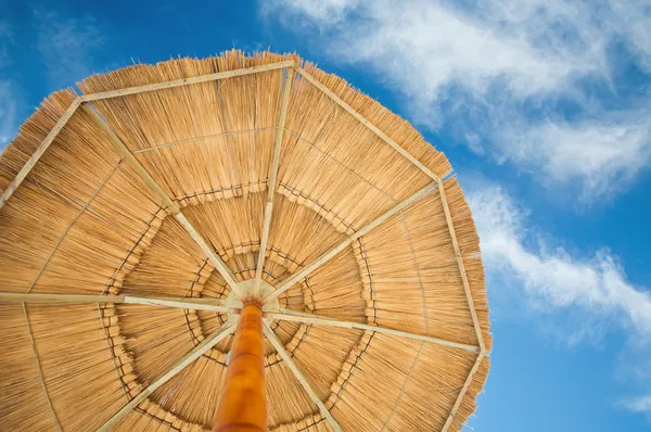 stock image Beach umbrella and cloudy sky