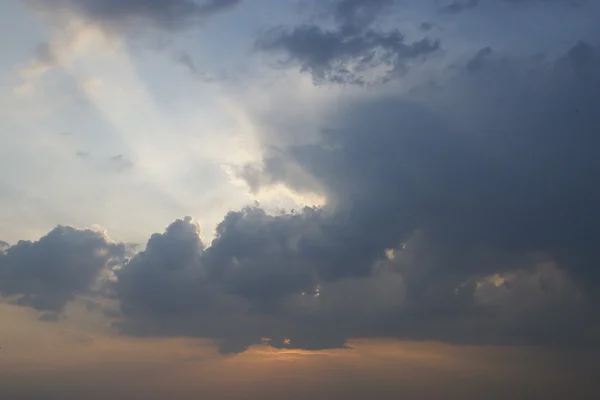 Sunset rays through rainclouds — Stock Photo, Image