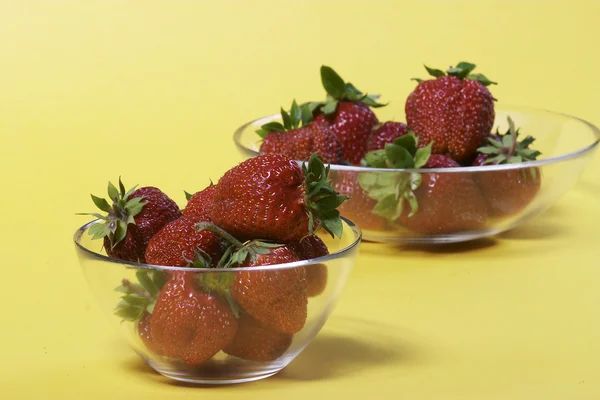 Strawberry bowl over yellow — Stock Photo, Image