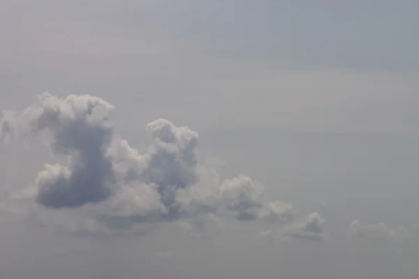 Wolken über Grau Stockbild