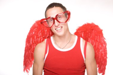 Young man smiles in red heart-glasses wi clipart