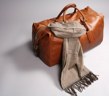 Brown leathe bag with scarf clipart