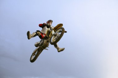 The motocross rider jumping over photogr clipart