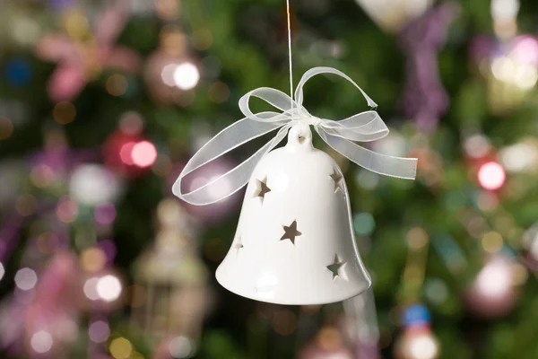 Christmas bell with tree and lights on b — Stock Photo, Image