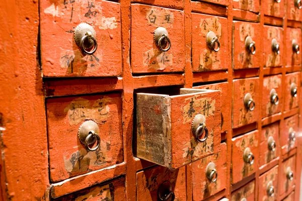 stock image Red drawer of old fashioned chinese cabi