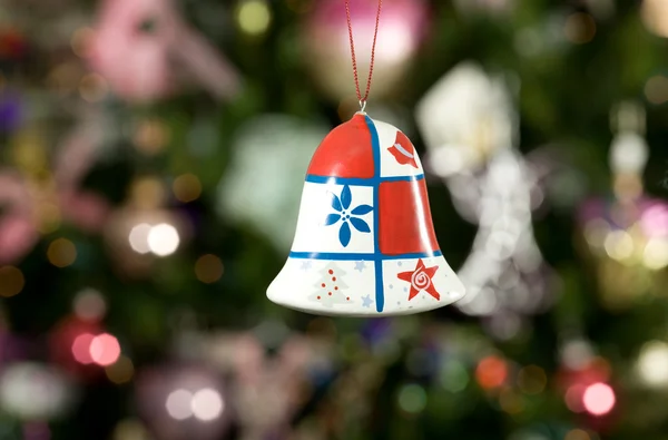 Christmas bell with tree and lights on b — Stock Photo, Image