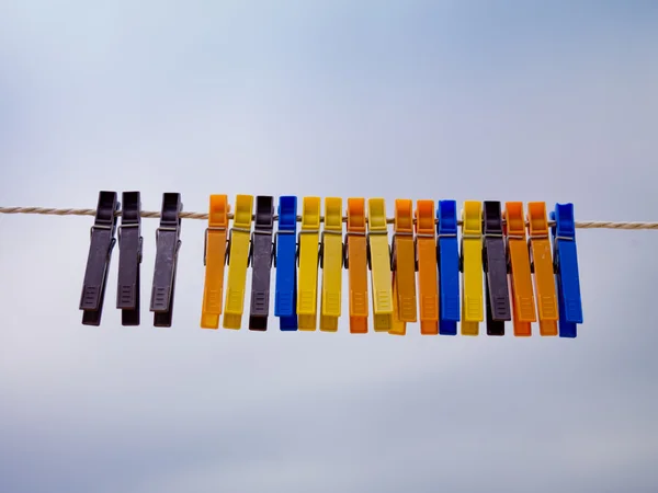Colorful clothepins on the line — Stock Photo, Image