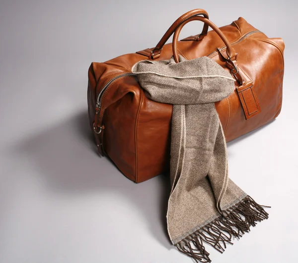 stock image Brown leathe bag with scarf