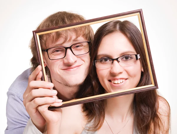 Lyckliga par i glas i ram — Stockfoto